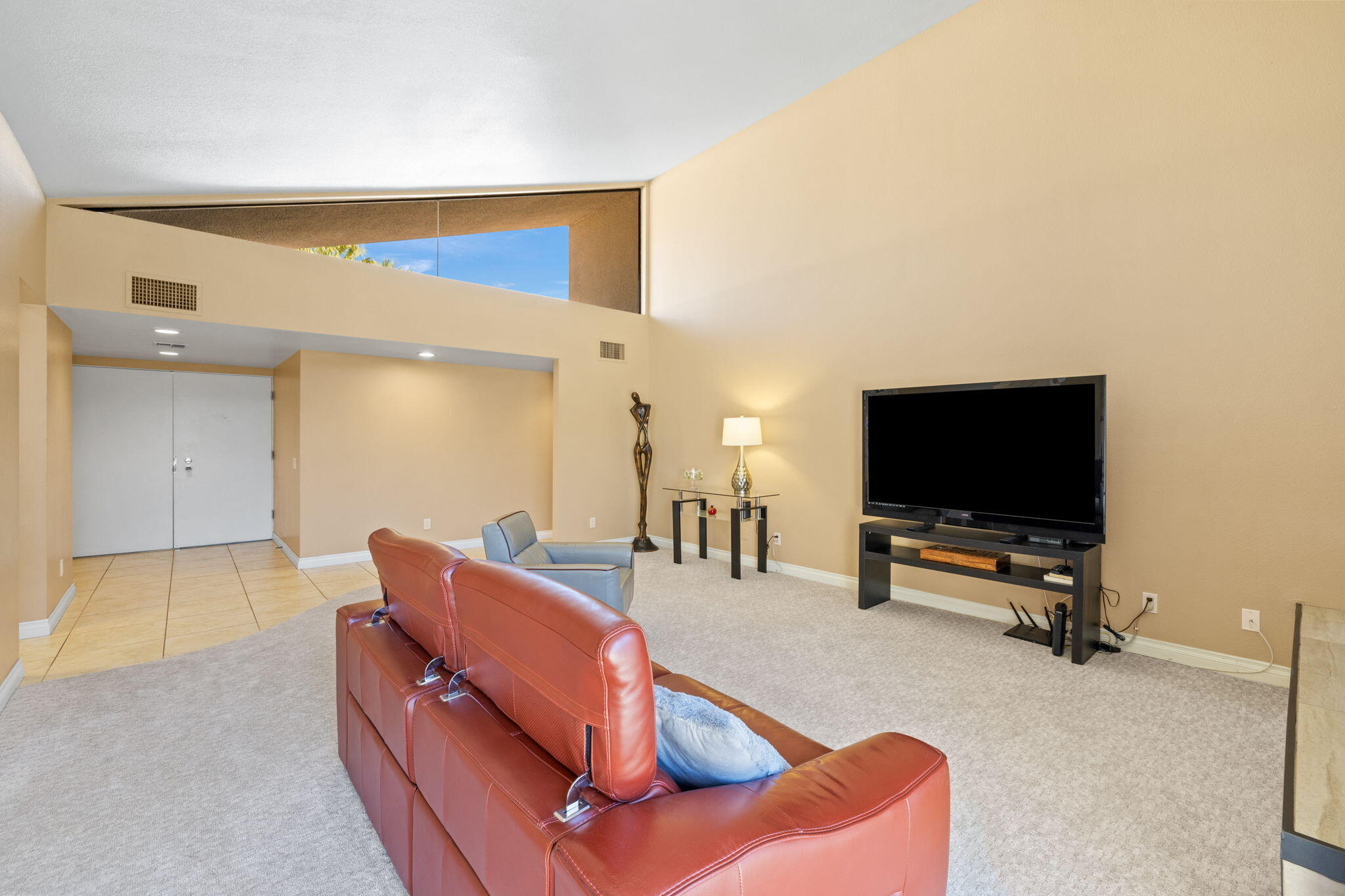 45775 Juniper Circle, Unit 616A Palm Desert, CA 92260 - Photo 3 of 35 a living room with furniture and a flat screen tv