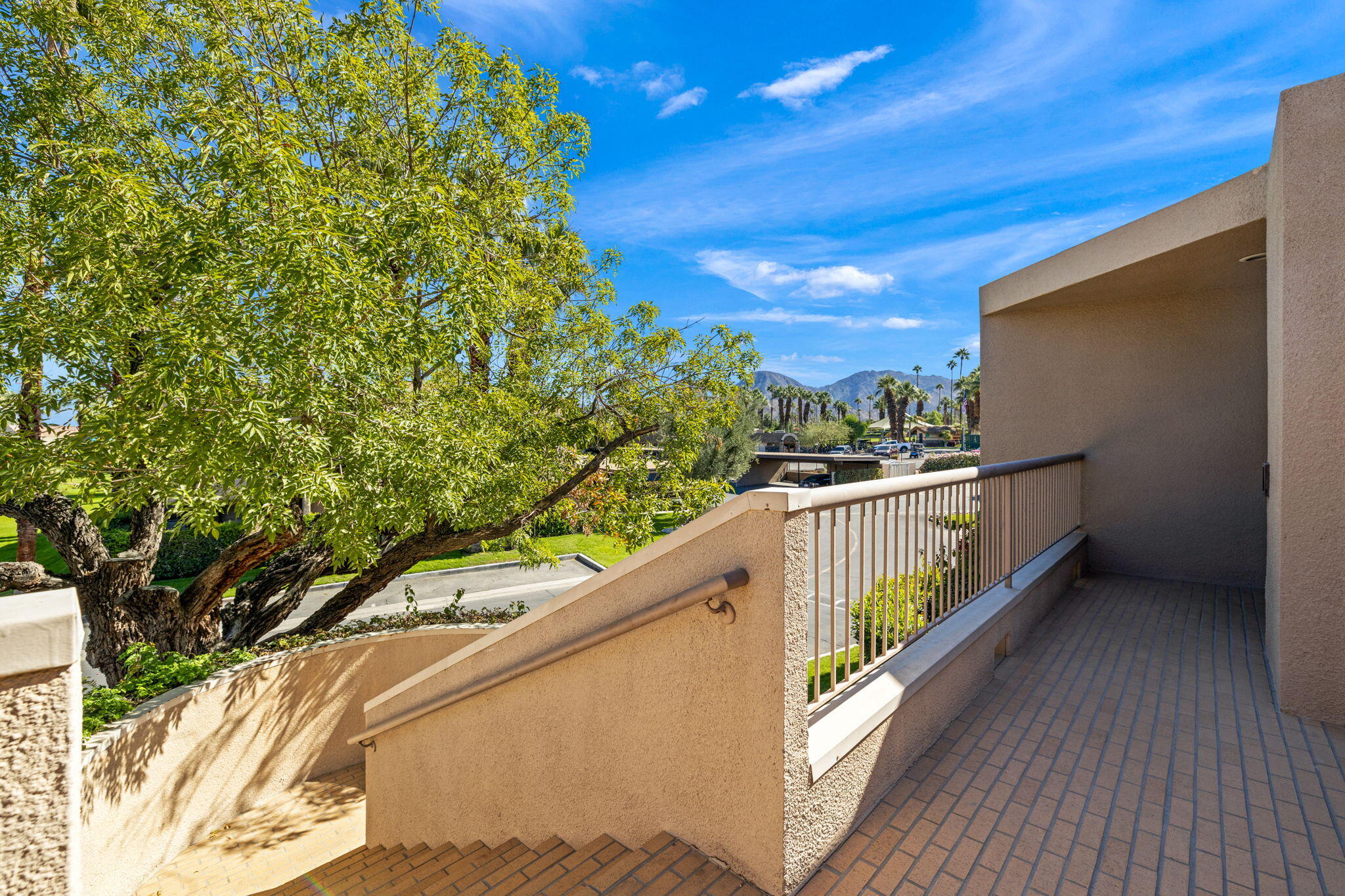 45775 Juniper Circle, Unit 616A Palm Desert, CA 92260 - Photo 31 of 35 a balcony with an outdoor space