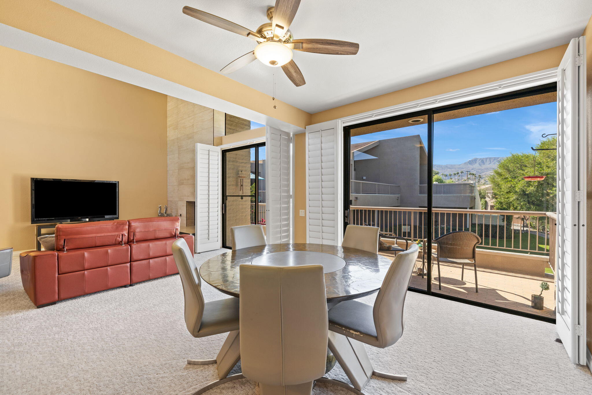 45775 Juniper Circle, Unit 616A Palm Desert, CA 92260 - Photo 5 of 35 a view of a livingroom with furniture and a flat screen tv