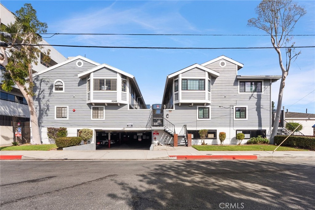 4345 154th Street, Unit 3 Lawndale, CA 90260 - Photo 1 of 31 a front view of a house with a road