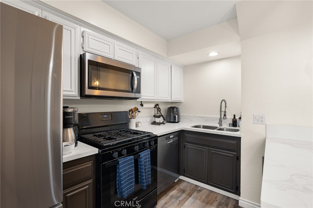 4345 154th Street, Unit 3 Lawndale, CA 90260 - Photo 13 of 31 a kitchen with stainless steel appliances a stove sink and microwave