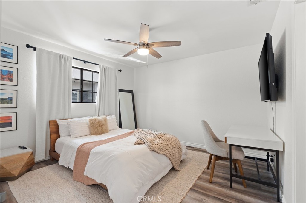 4345 154th Street, Unit 3 Lawndale, CA 90260 - Photo 27 of 31 a bedroom with a bed and wooden floor