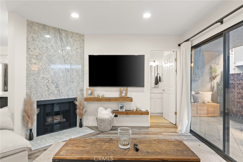 4345 154th Street, Unit 3 Lawndale, CA 90260 - Photo 4 of 31 a living room with furniture a flat screen tv and a fireplace