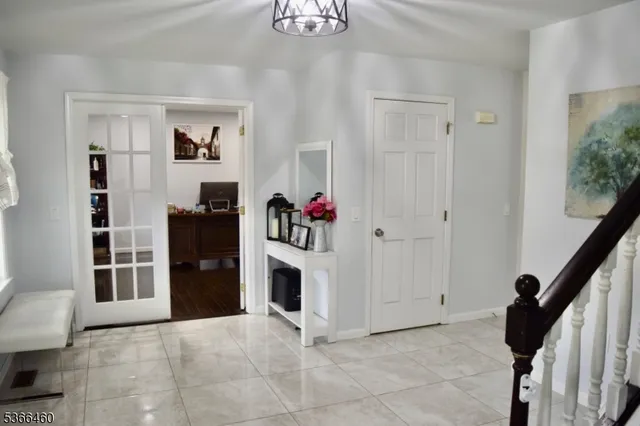 a view of kitchen with furniture and white walls