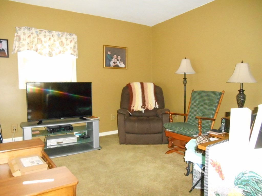 190 Dominion Road Worcester, MA 01605 - Photo 4 of 13 a living room with furniture and a flat screen tv