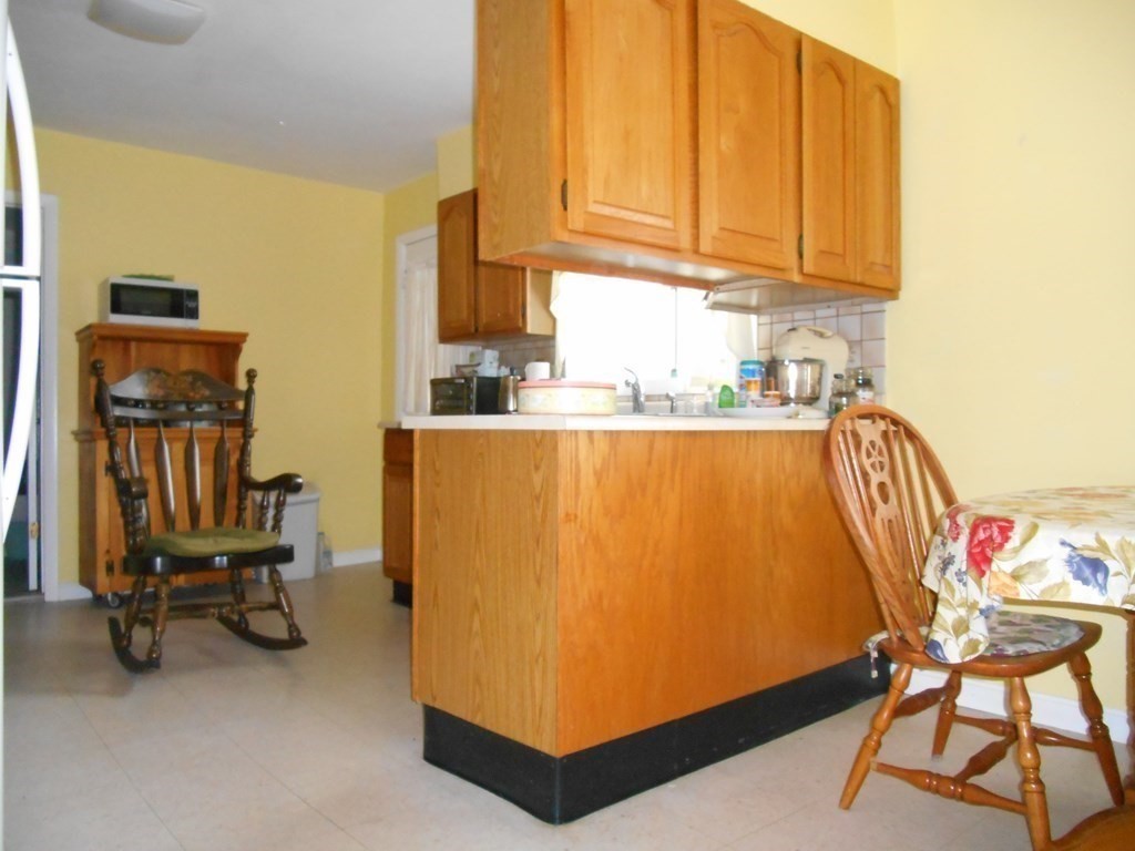 190 Dominion Road Worcester, MA 01605 - Photo 7 of 13 a view of workspace with wooden wall furniture and a window