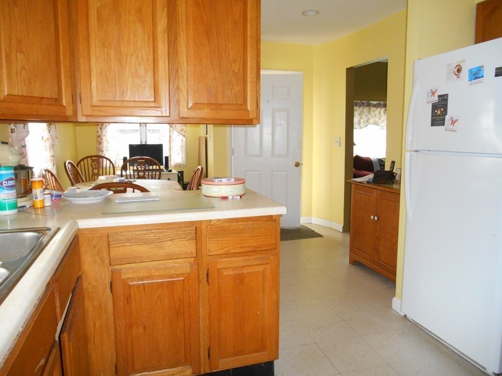 190 Dominion Road Worcester, MA 01605 - Photo 8 of 13 a kitchen with stainless steel appliances granite countertop a refrigerator a sink and white cabinets