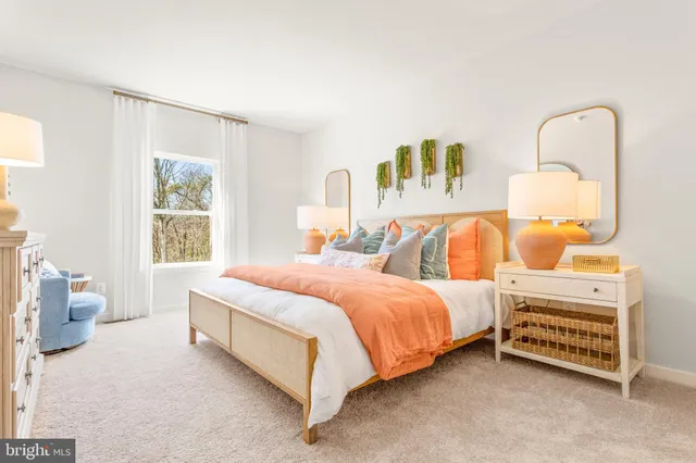 a bedroom with a bed and dresser