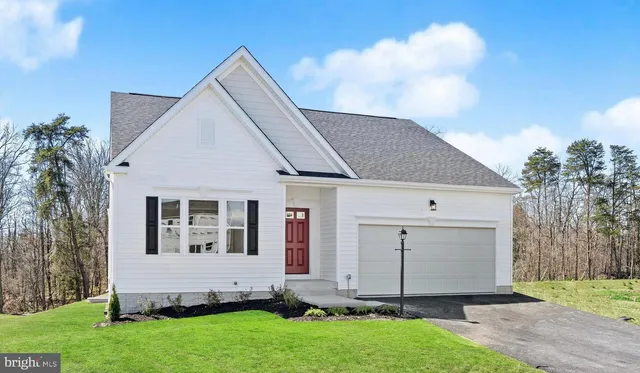 a view of front of house with a yard