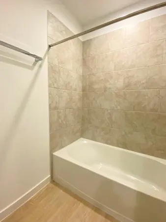 an empty room with a empty space and windows