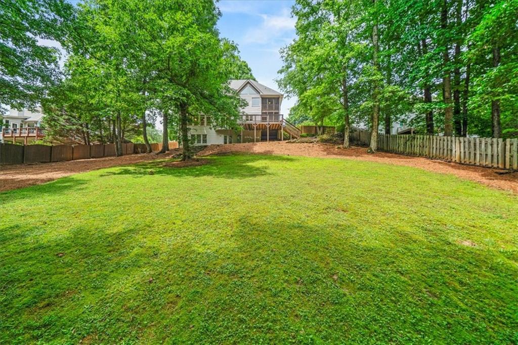 1710 Rising Mist Lane Cumming, GA 30041 - Photo 6 of 111 a view of a house with a yard and sitting area