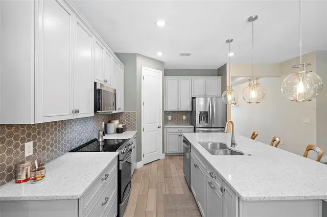a living room with furniture and windows