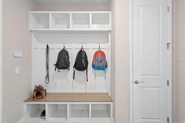 a bathroom with a double vanity sink mirror and shower