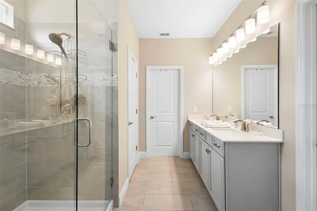 a bedroom with furniture and a flat screen tv