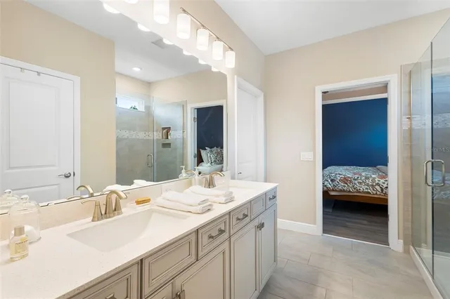 a bedroom with furniture and a flat screen tv