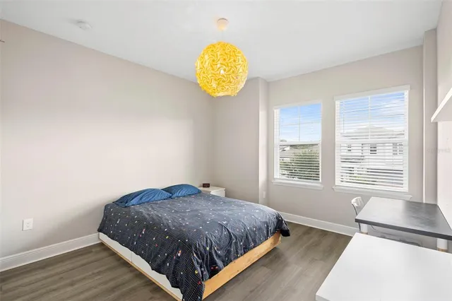 a front view of a house with a garden and plants