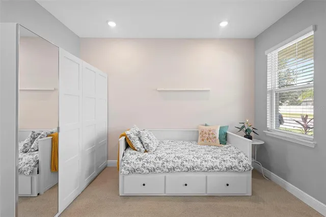 a view of an house with backyard space and balcony