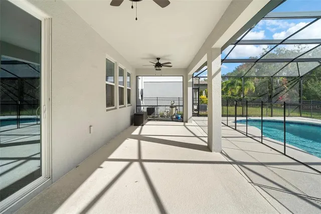 an aerial view of a house with swimming pool garden and patio