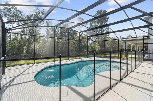 a living room with fireplace furniture and a large window