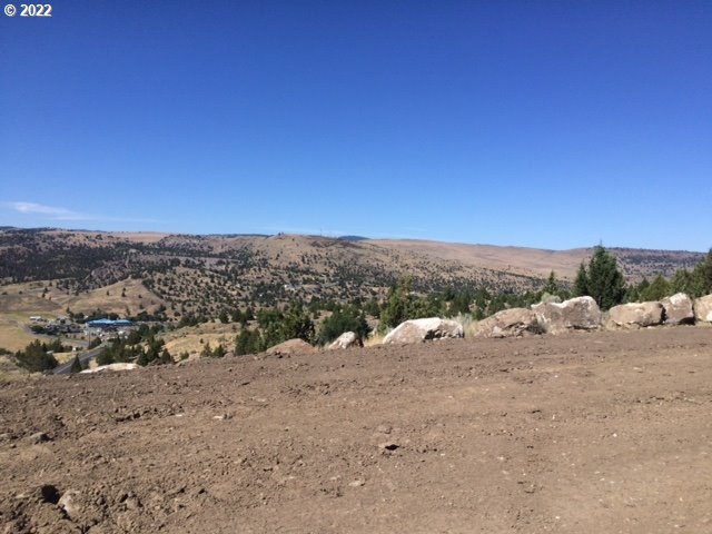 74 B County Road John Day, OR 97845 - Photo 2 of 7 a view of a dry yard with wooden fence