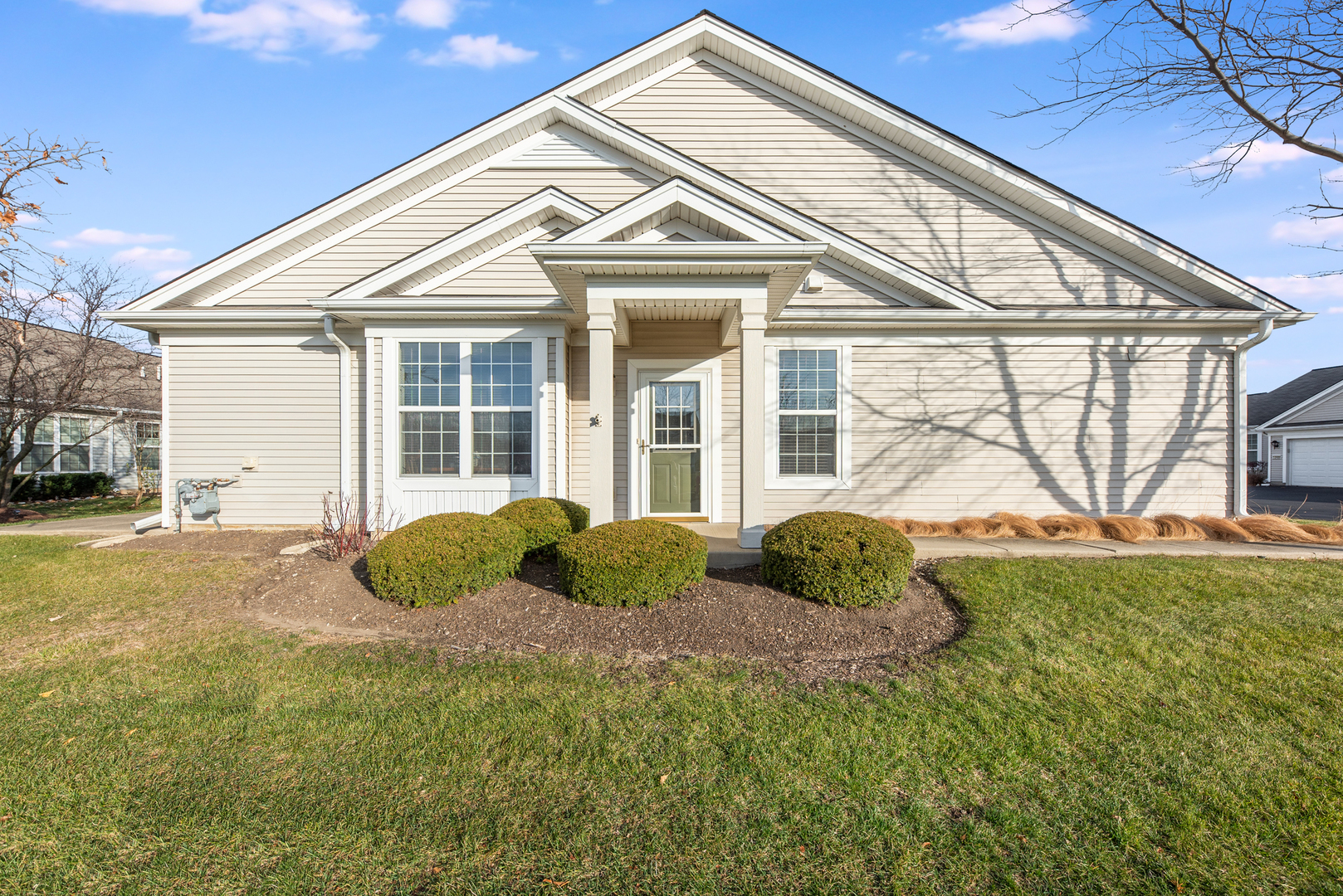13512 Delaney Road Huntley, IL 60142 - Photo 1 of 24 a front view of a house with garden