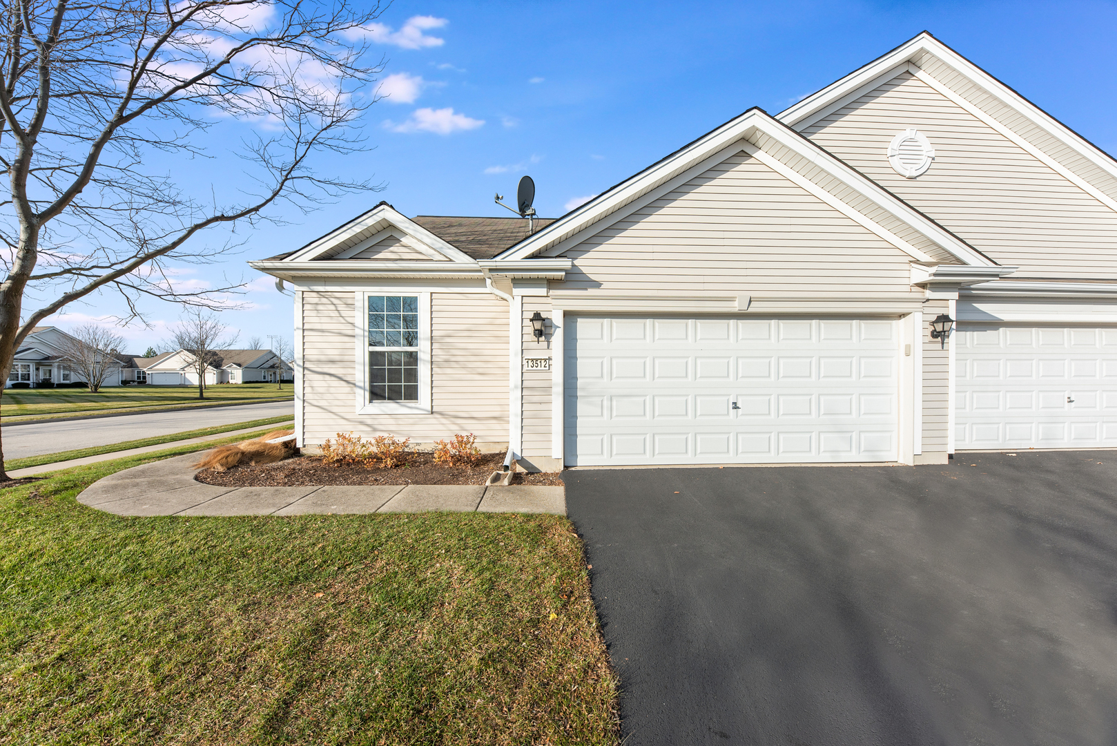 13512 Delaney Road Huntley, IL 60142 - Photo 17 of 24 a front view of a house with a yard