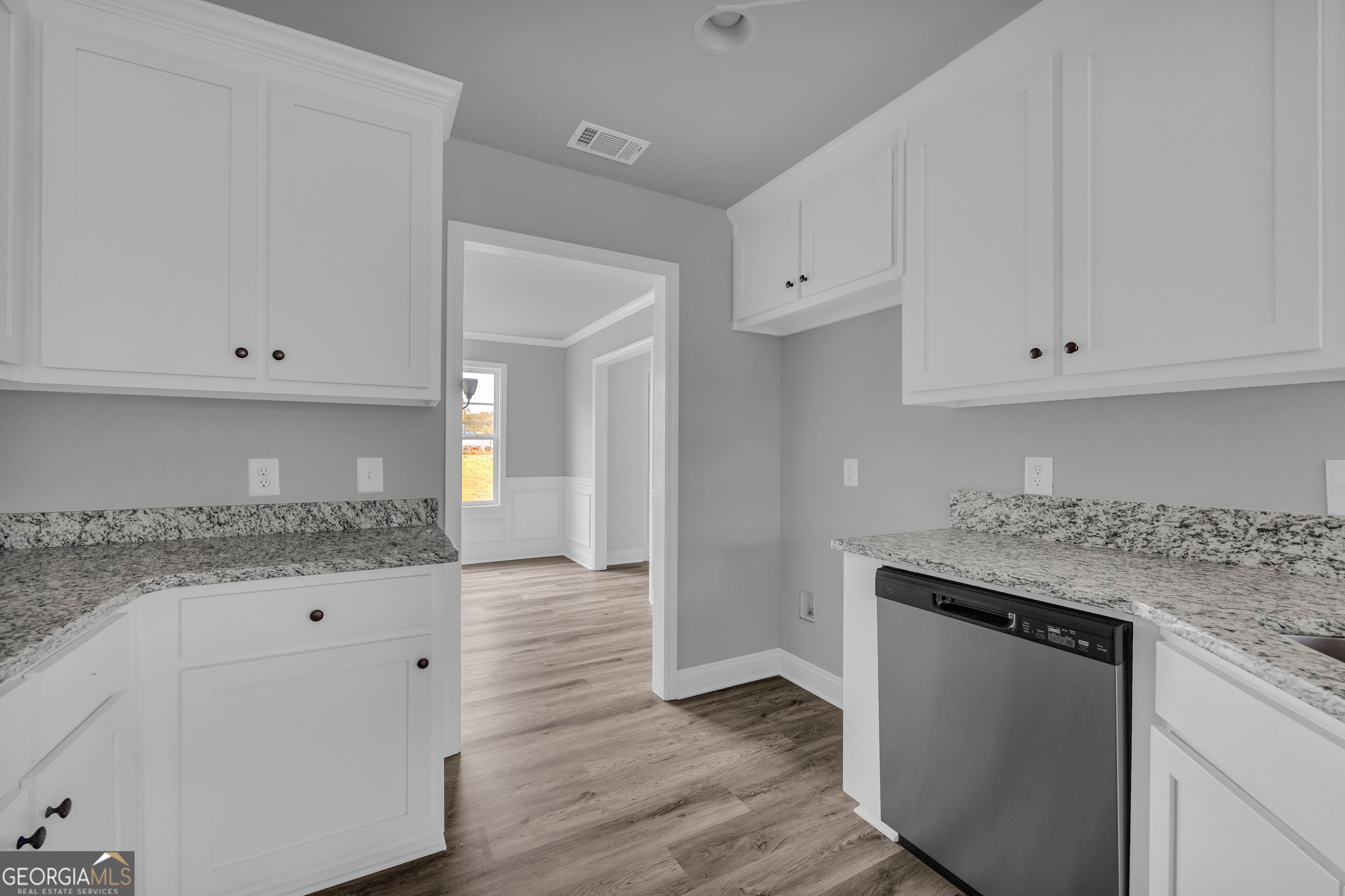 152 Sewell Road Lavonia, GA 30553 - Photo 11 of 60 a kitchen with granite countertop white cabinets and a sink