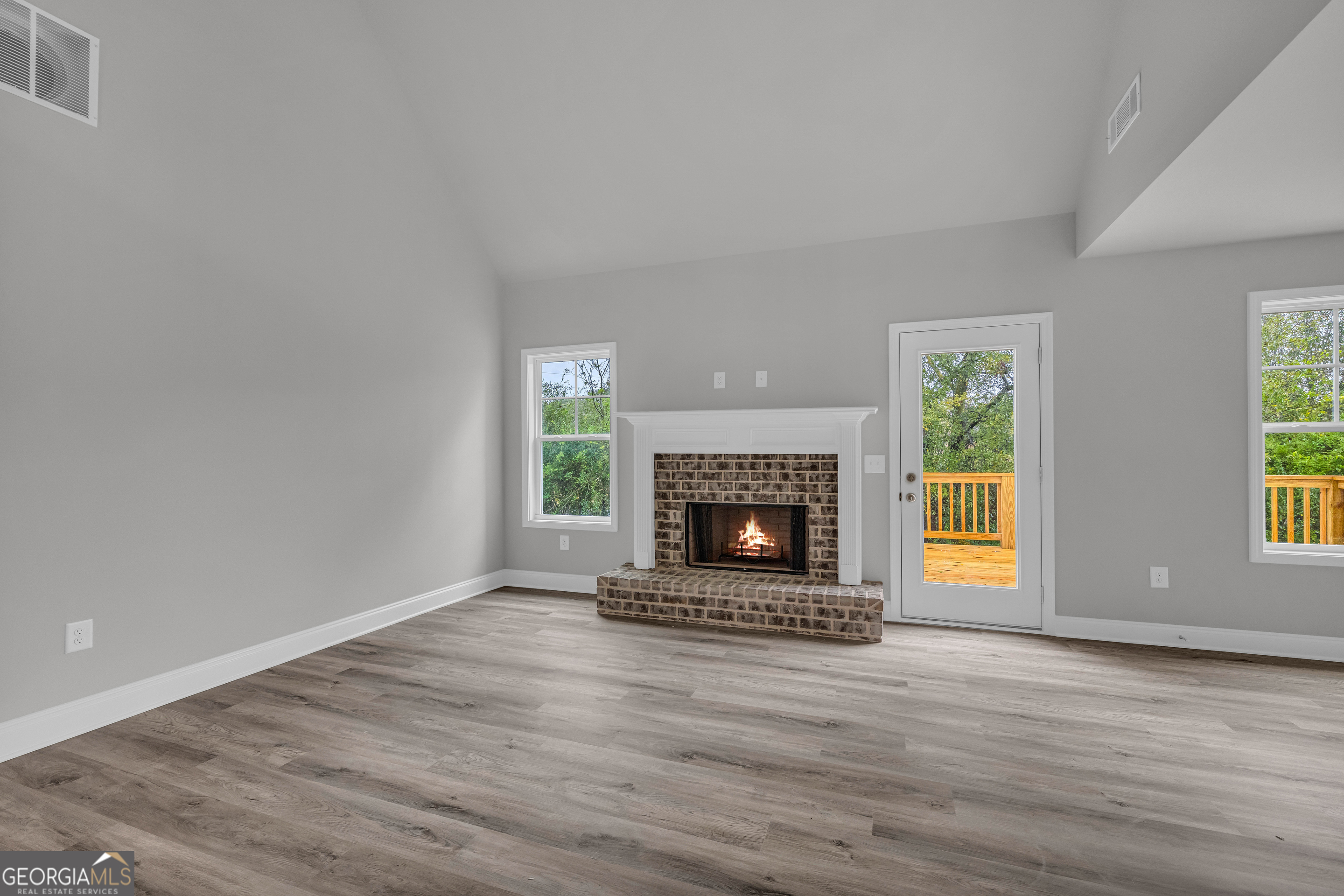 152 Sewell Road Lavonia, GA 30553 - Photo 20 of 60 a living room with a fireplace and a fireplace