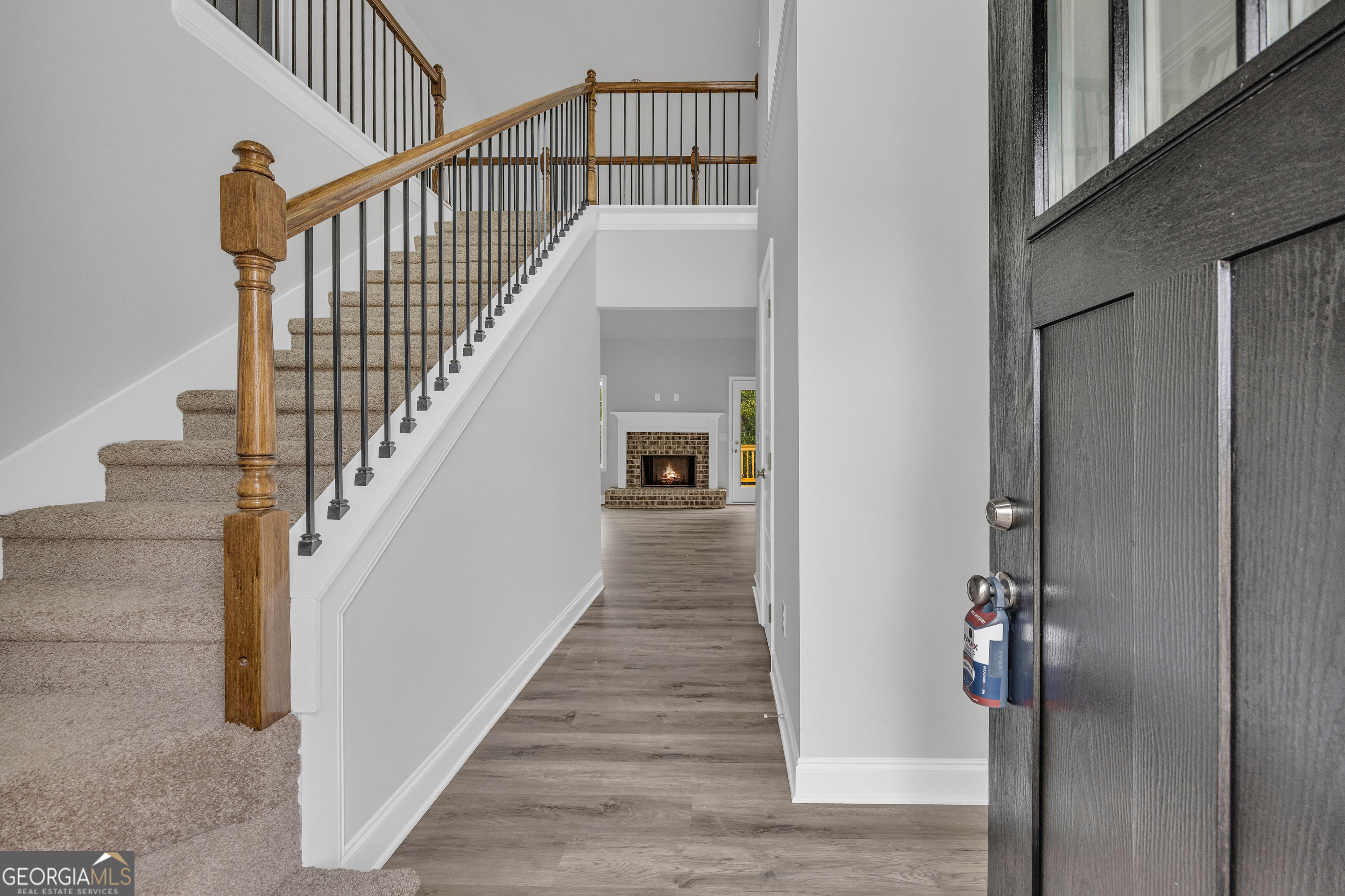 152 Sewell Road Lavonia, GA 30553 - Photo 2 of 60 a view of a hallway with wooden floor and entryway