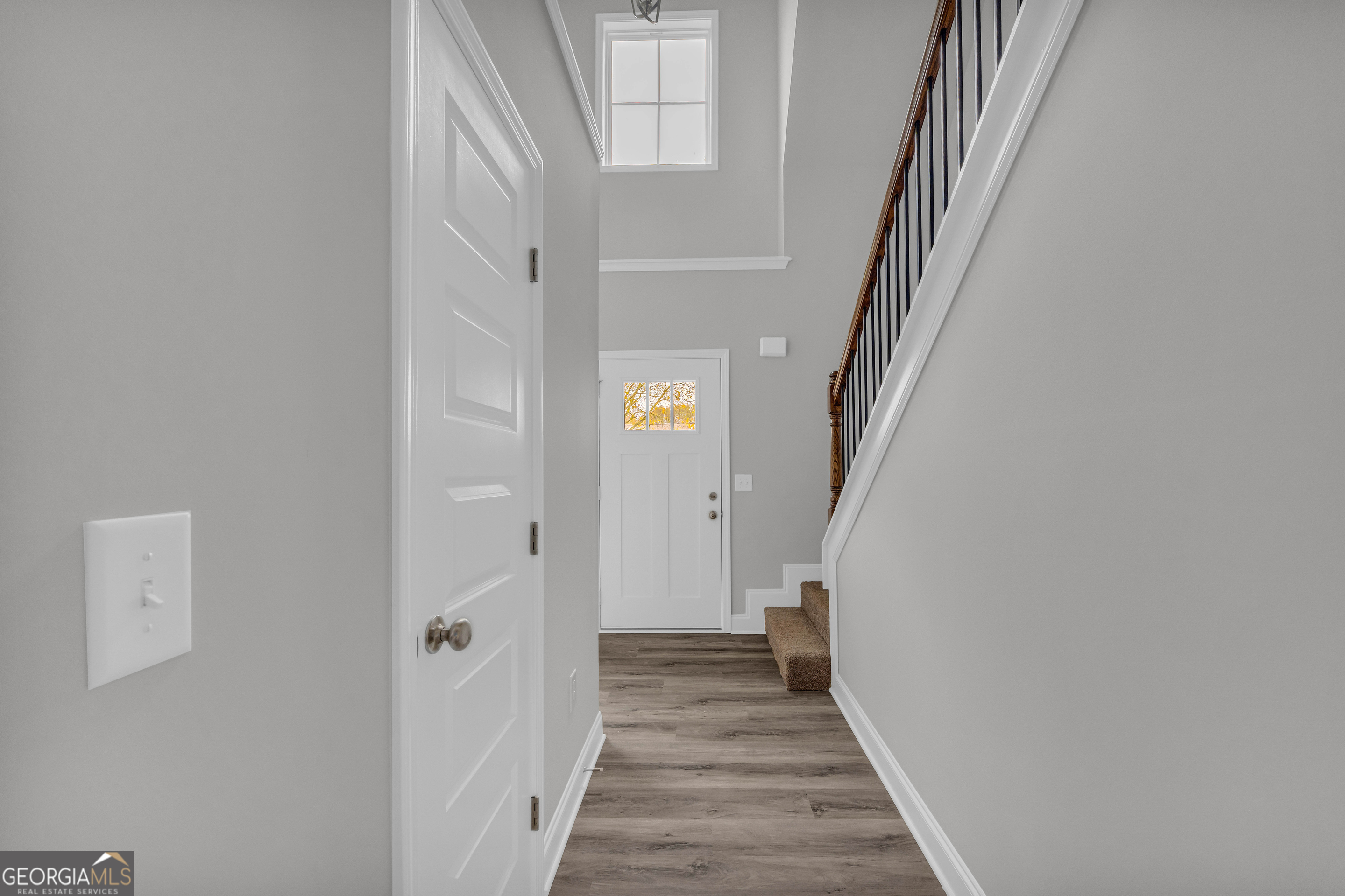 152 Sewell Road Lavonia, GA 30553 - Photo 3 of 60 a view of a hallway with wooden floor and entryway