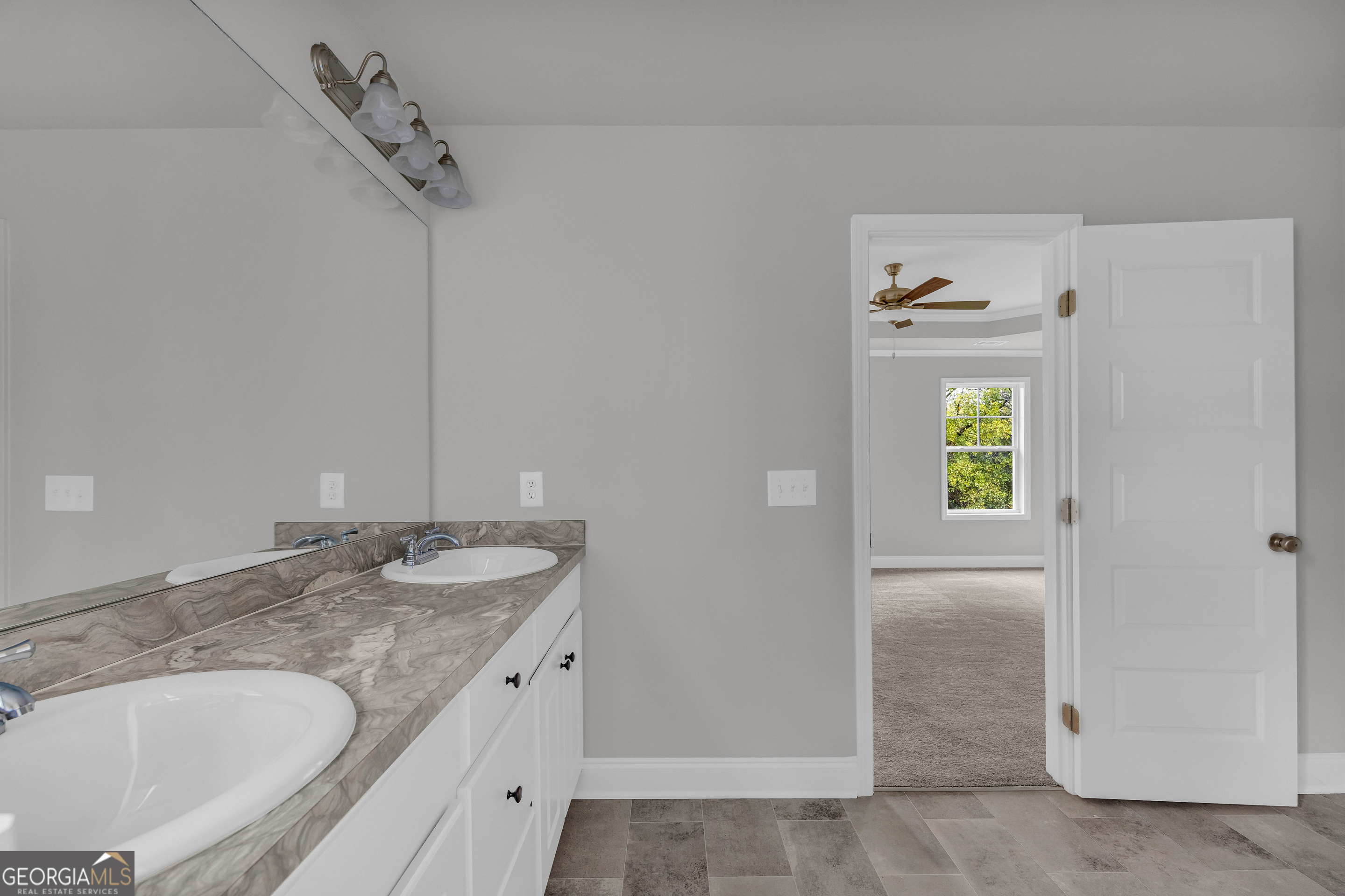 152 Sewell Road Lavonia, GA 30553 - Photo 31 of 60 a bathroom with a granite countertop sink and a mirror