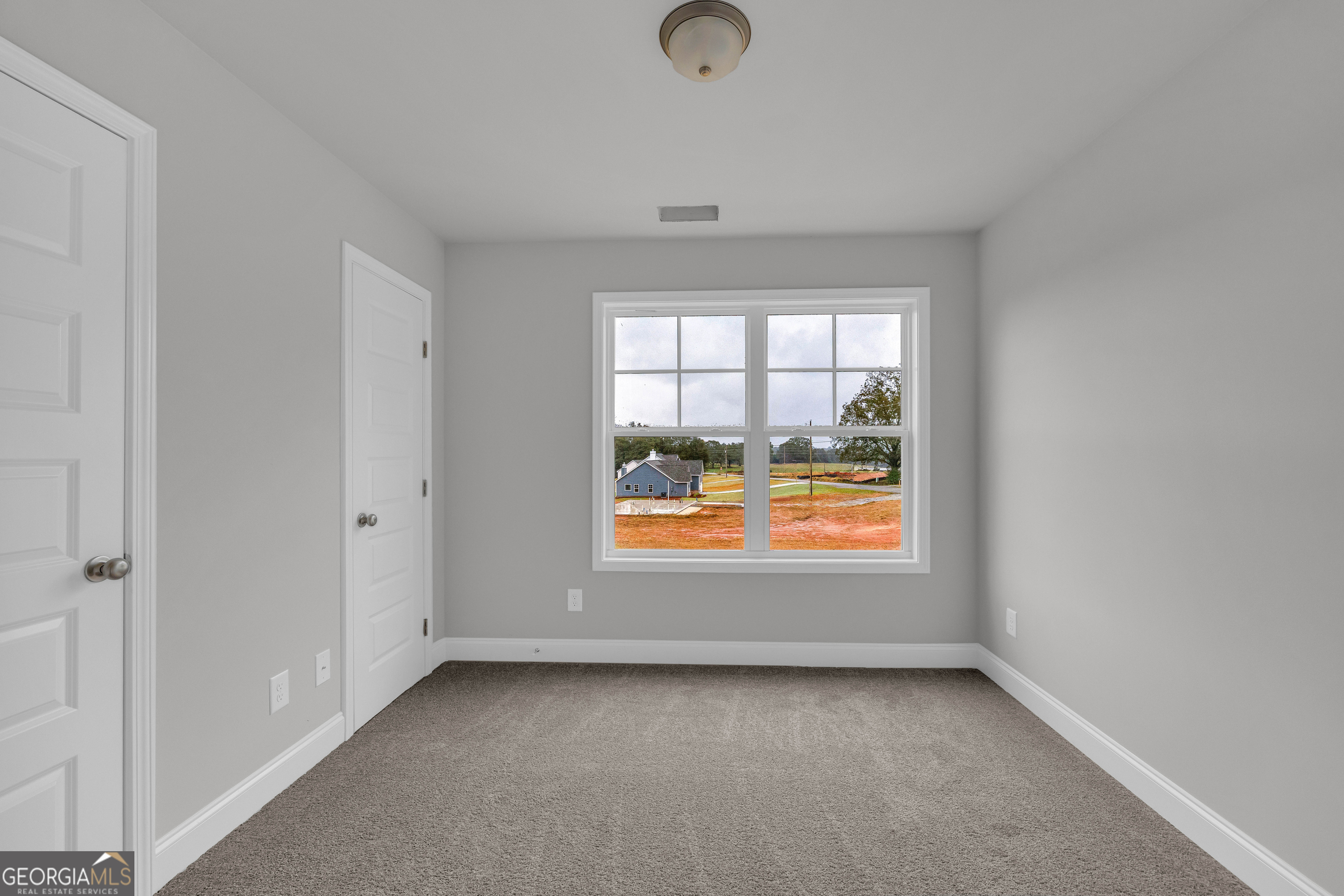 152 Sewell Road Lavonia, GA 30553 - Photo 36 of 60 an empty room with a window
