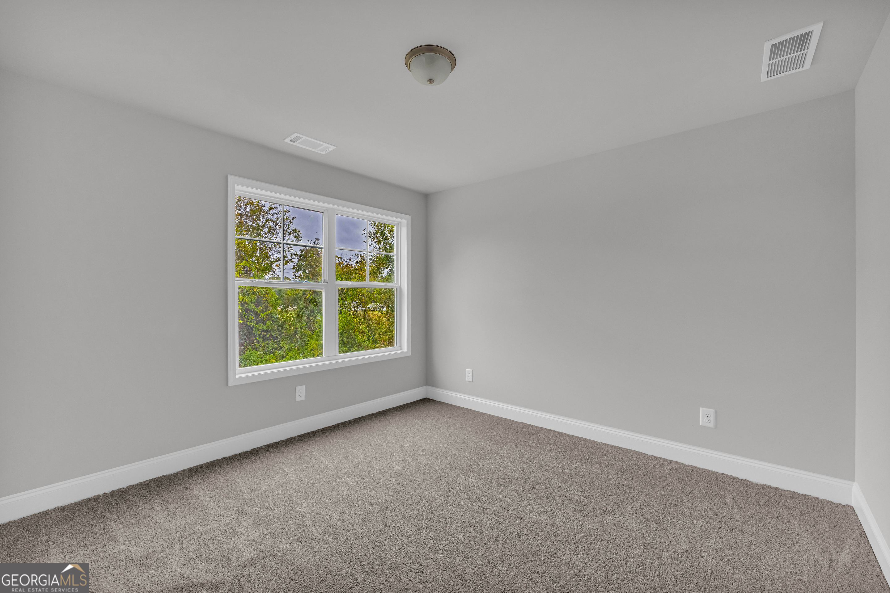 152 Sewell Road Lavonia, GA 30553 - Photo 42 of 60 an empty room with a window