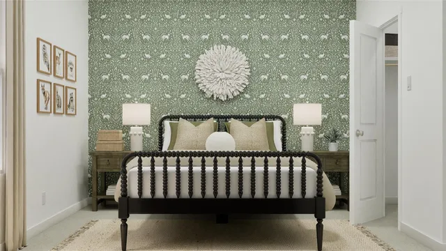 a bed sitting in a bedroom next to a bathroom