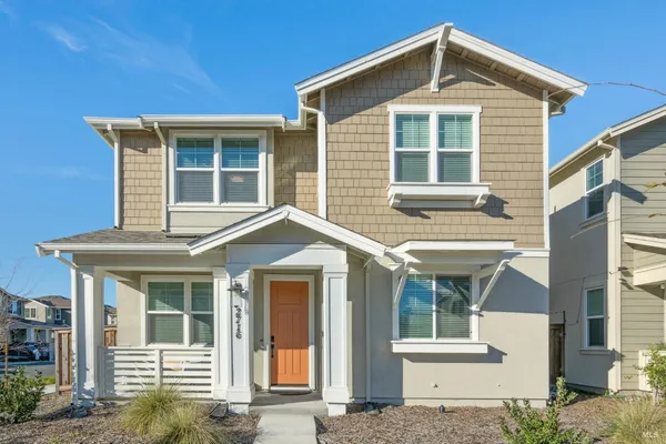 a front view of a house with a yard