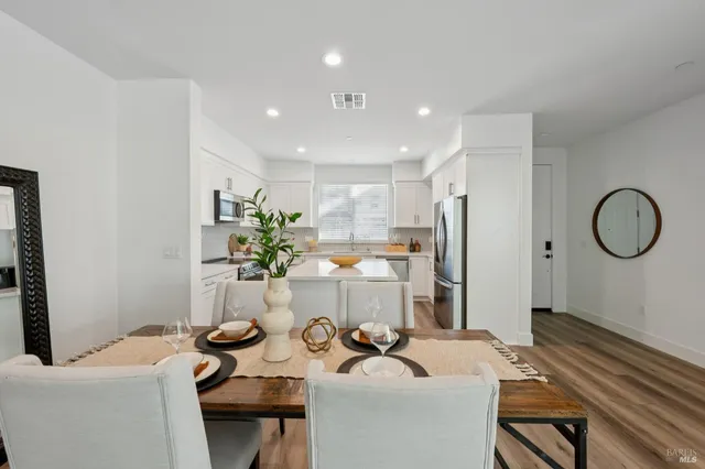 a very nice looking dining room with a table and chairs