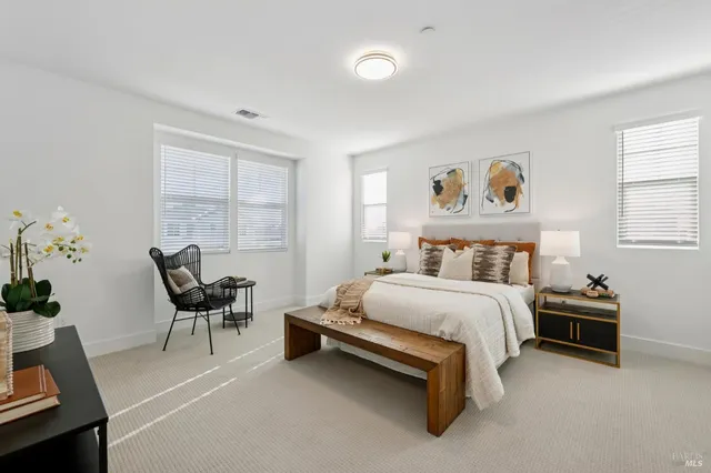 a bedroom with a bed and a couch