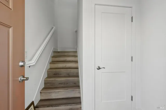 a kitchen with stainless steel appliances granite countertop a sink and a microwave