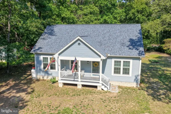 a house with trees in the background