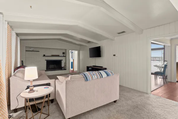 a workspace with wooden floor and a window