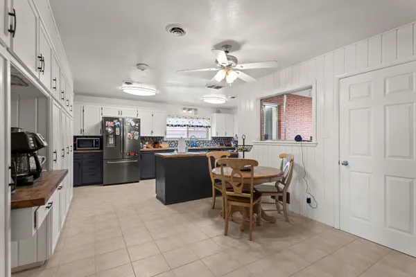 a view of living room with furniture and windows