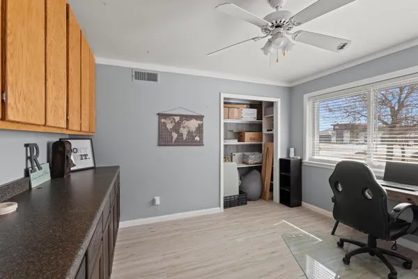 a bathroom with a sink a toilet a mirror and shower