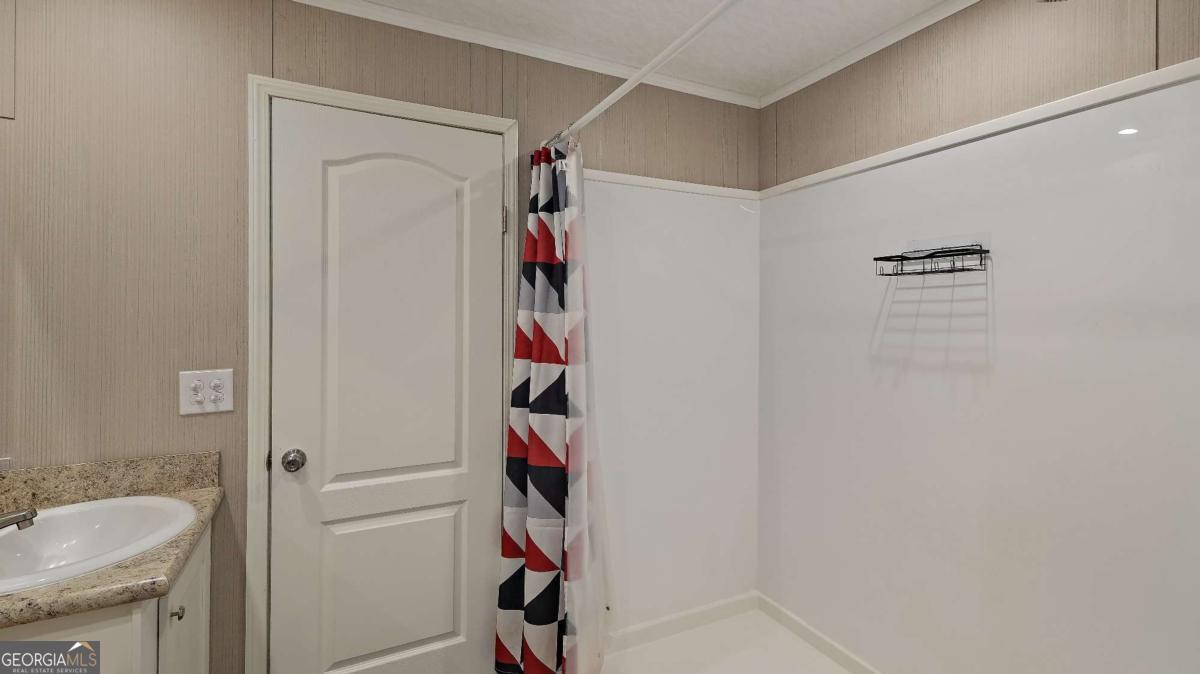 64 Sierra Road Jesup, GA 31545 - Photo 20 of 22 a bathroom with a shower and a sink