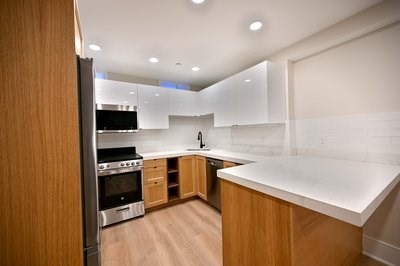 18 Winchester Street, Unit 2 Boston, MA 02116 - Photo 1 of 13 a kitchen with a sink a stove and cabinets