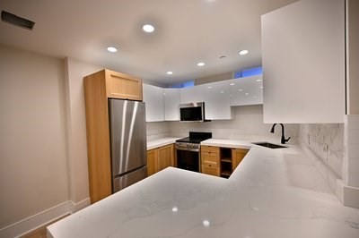 18 Winchester Street, Unit 2 Boston, MA 02116 - Photo 4 of 13 a kitchen with refrigerator and microwave