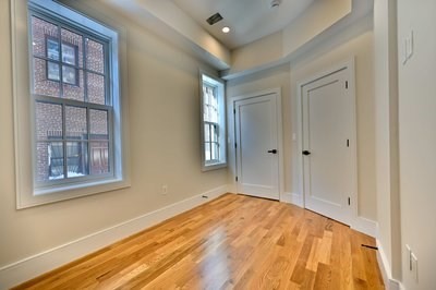 18 Winchester Street, Unit 2 Boston, MA 02116 - Photo 5 of 13 a view of empty room with window and wooden floor