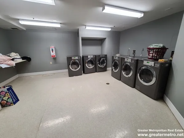 a view of a storage & utility room with washer and dryer