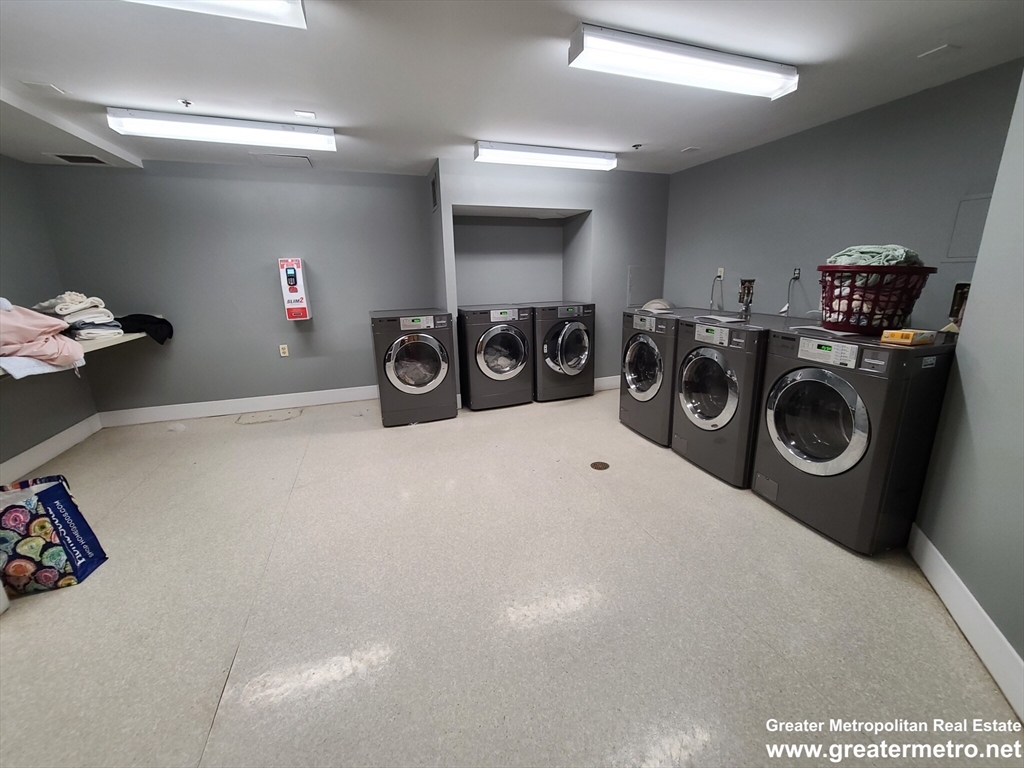 357 Commercial Street, Unit 507 Boston, MA 02109 - Photo 16 of 22 a view of a storage & utility room with washer and dryer