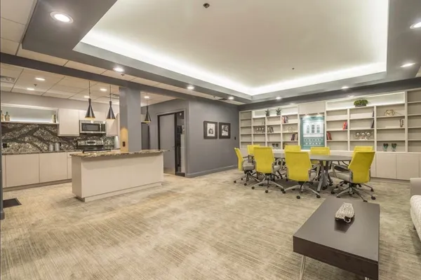 a view of open kitchen with a table and chairs