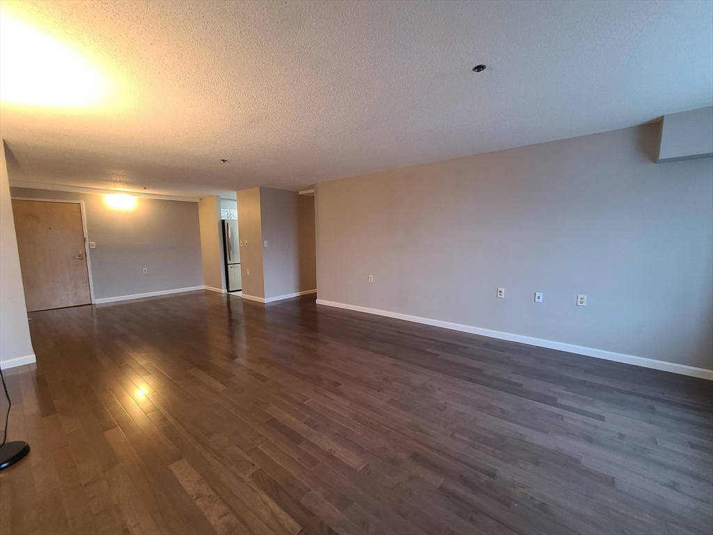 357 Commercial Street, Unit 507 Boston, MA 02109 - Photo 7 of 22 a view of a room with wooden floor